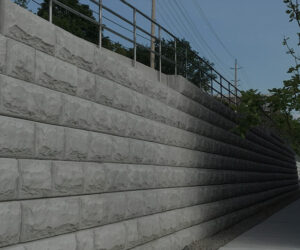 The image features a concrete wall beside a building, highlighting the MCON architectural elements.