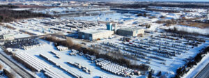 Aerial view of a large MCON warehouse surrounded by snow-covered ground.